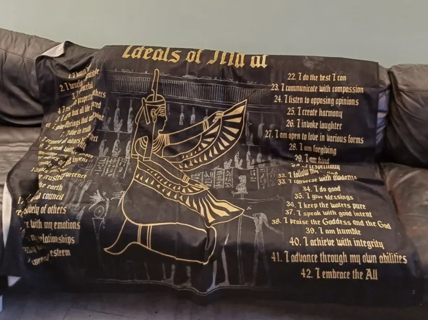 Ma'at tapestry on couch